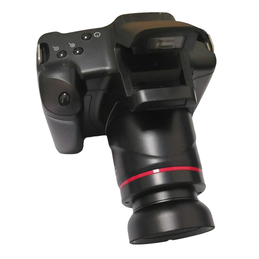 Black matte plastic digital camera with a pop-up flash and a lens featuring a red ring accent.