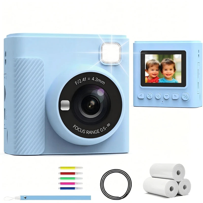 Light blue plastic digital instant print camera for kids with LCD screen, built-in flash, markers, and paper rolls.