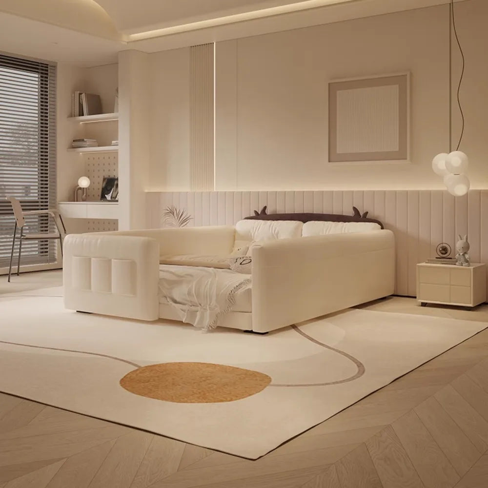 Cream-coloured parent-child bed with protective guardrails and whimsical cow-ear detail on the headboard.