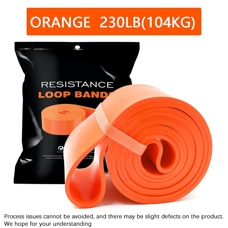 Heavy-duty orange resistance loop band for fitness, with a maximum 230lb/104kg rating, shown with its storage bag.