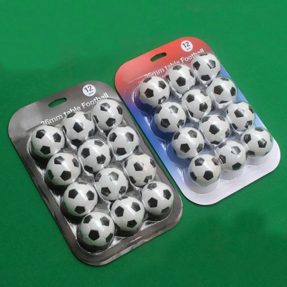 Two packs of 12 classic black and white 36mm table footballs in clear plastic blister packaging.