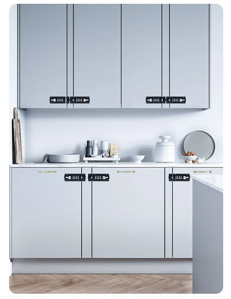 Black metal combination cabinet locks mounted on light grey kitchen cupboard doors.