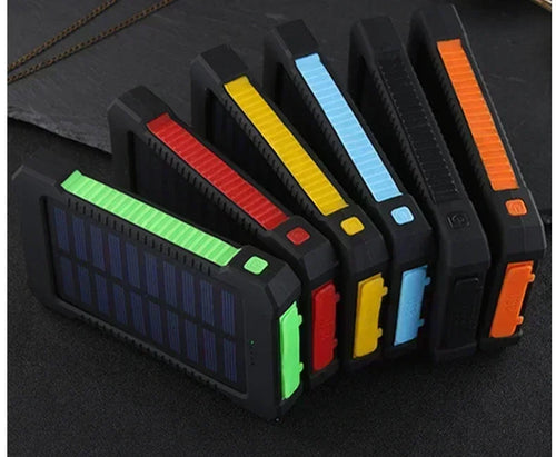 Six rugged, portable solar power banks in black with colourful edge accents, featuring built-in solar panels.