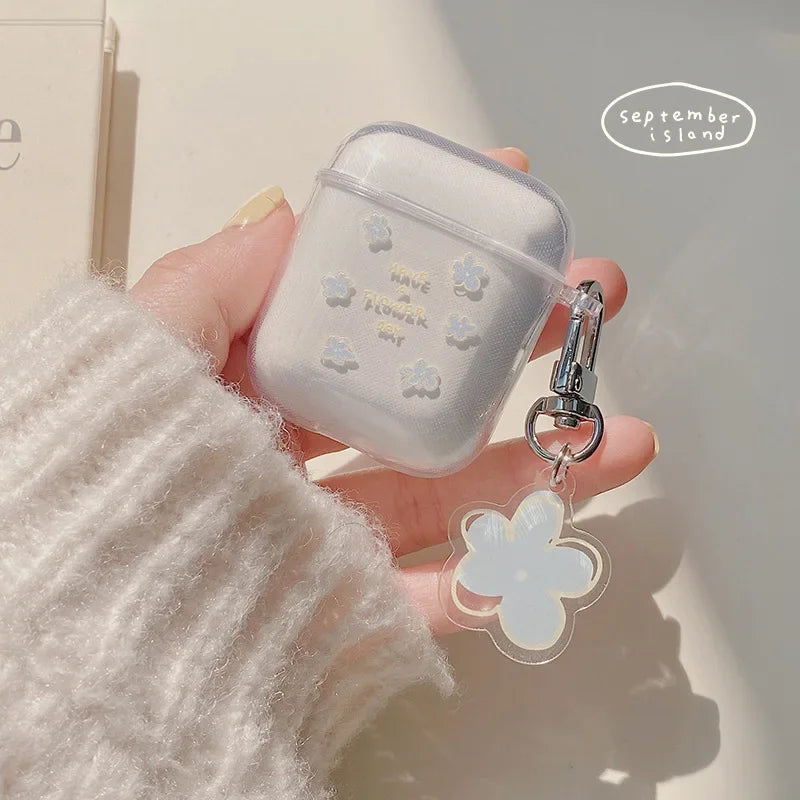 Clear floral AirPods case for 1st/2nd Gen with matching flower charm keyring.