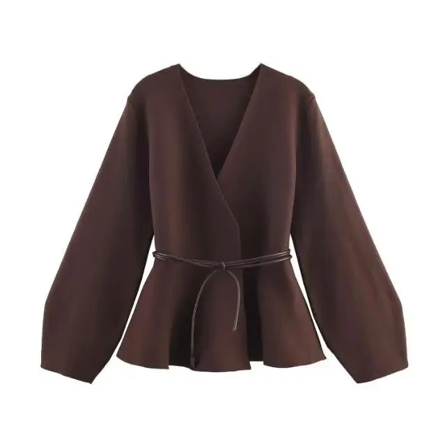 Dark brown long-sleeve wrap jacket with a V-neck, flared peplum hem, and a thin tie-waist belt.