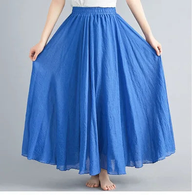 Blue maxi skirt with a high, elasticated waist and a flowing, flared silhouette in a lightweight fabric.
