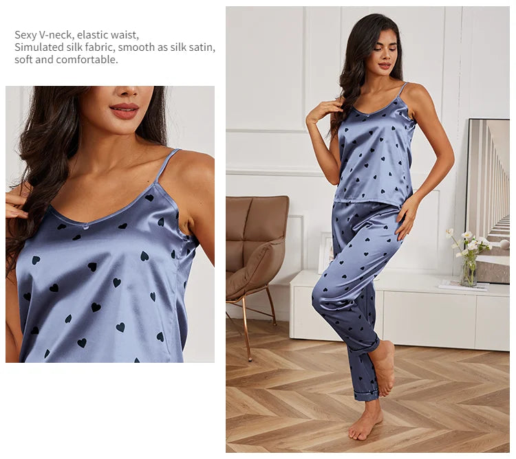Blue satin pyjama set with a black heart print, featuring a V-neck camisole and comfortable elasticated trousers.