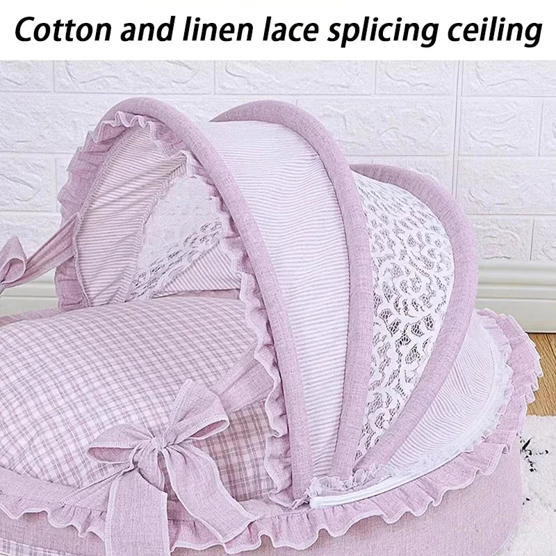 Pink and white checked luxury pet bed with a hooded, lace-trimmed canopy and bows.