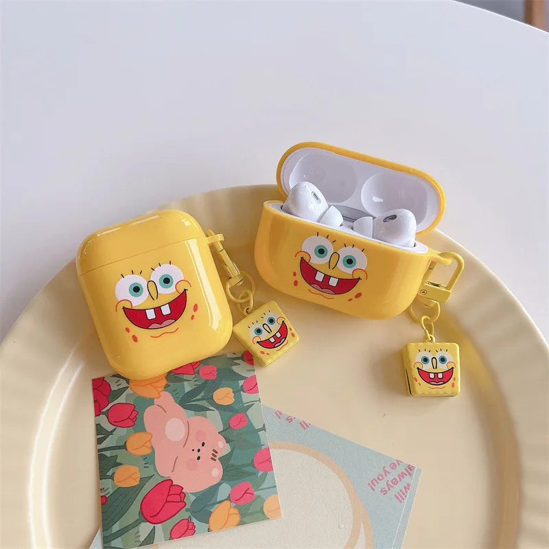 Yellow silicone SpongeBob SquarePants case for Apple AirPods, featuring a matching character charm.