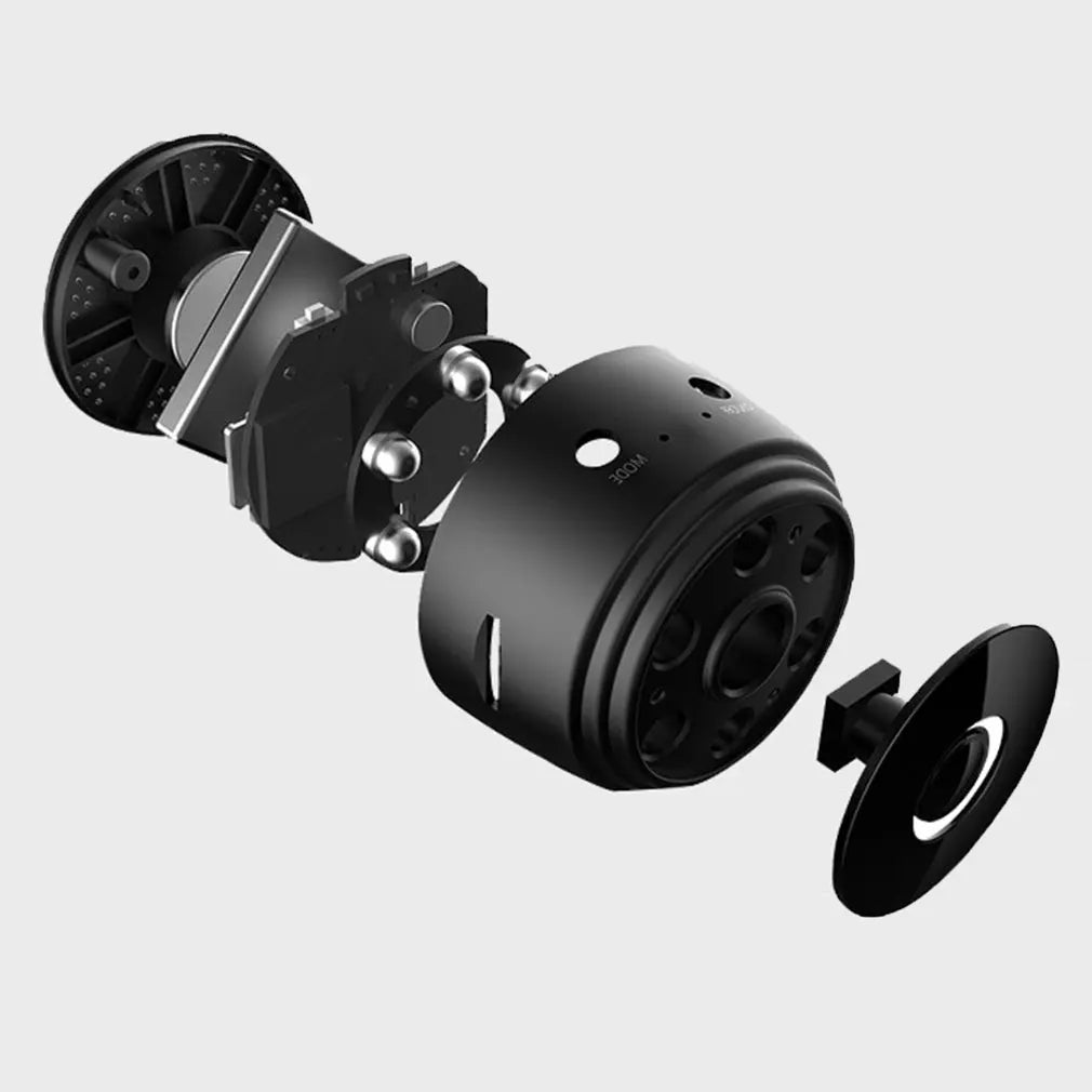 Exploded view of a black metal cylindrical device showing internal circular circuit boards, metal balls, and a lens cap.