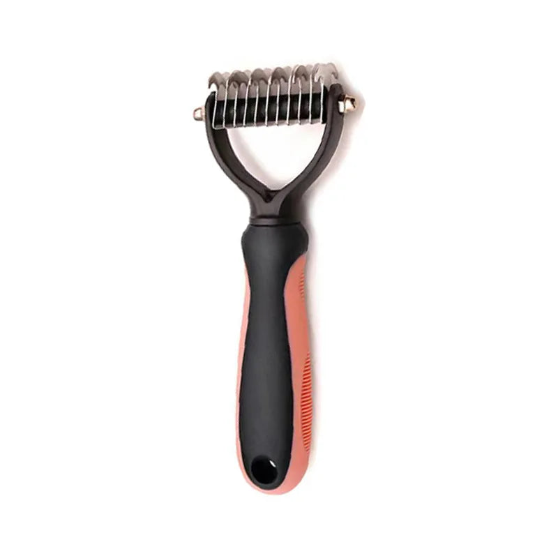 Pet grooming rake with a black and pink ergonomic handle and a stainless steel dual-sided serrated blade head.