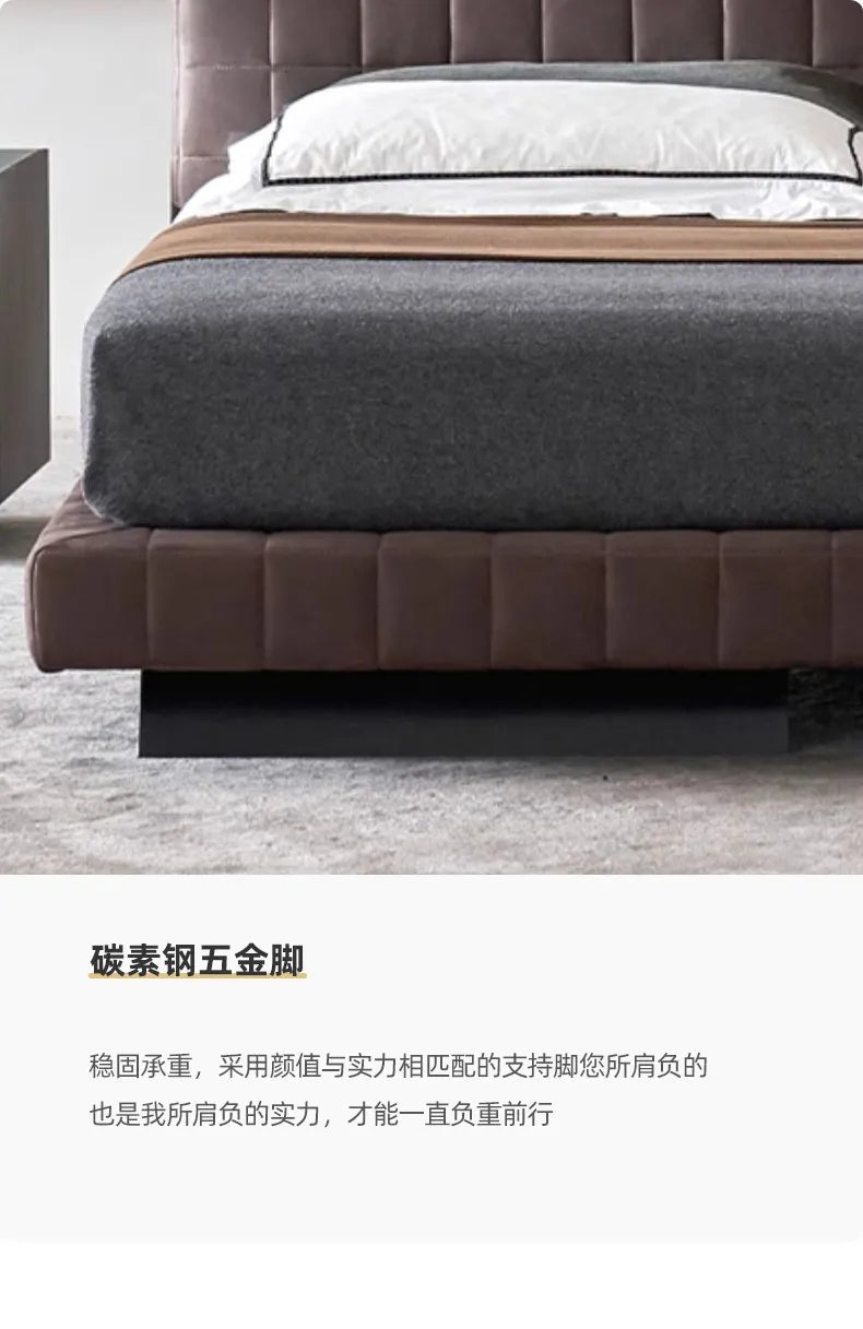 Modern Nordic bed frame in chocolate brown upholstery, featuring a stylish panelled design and a sleek black base.