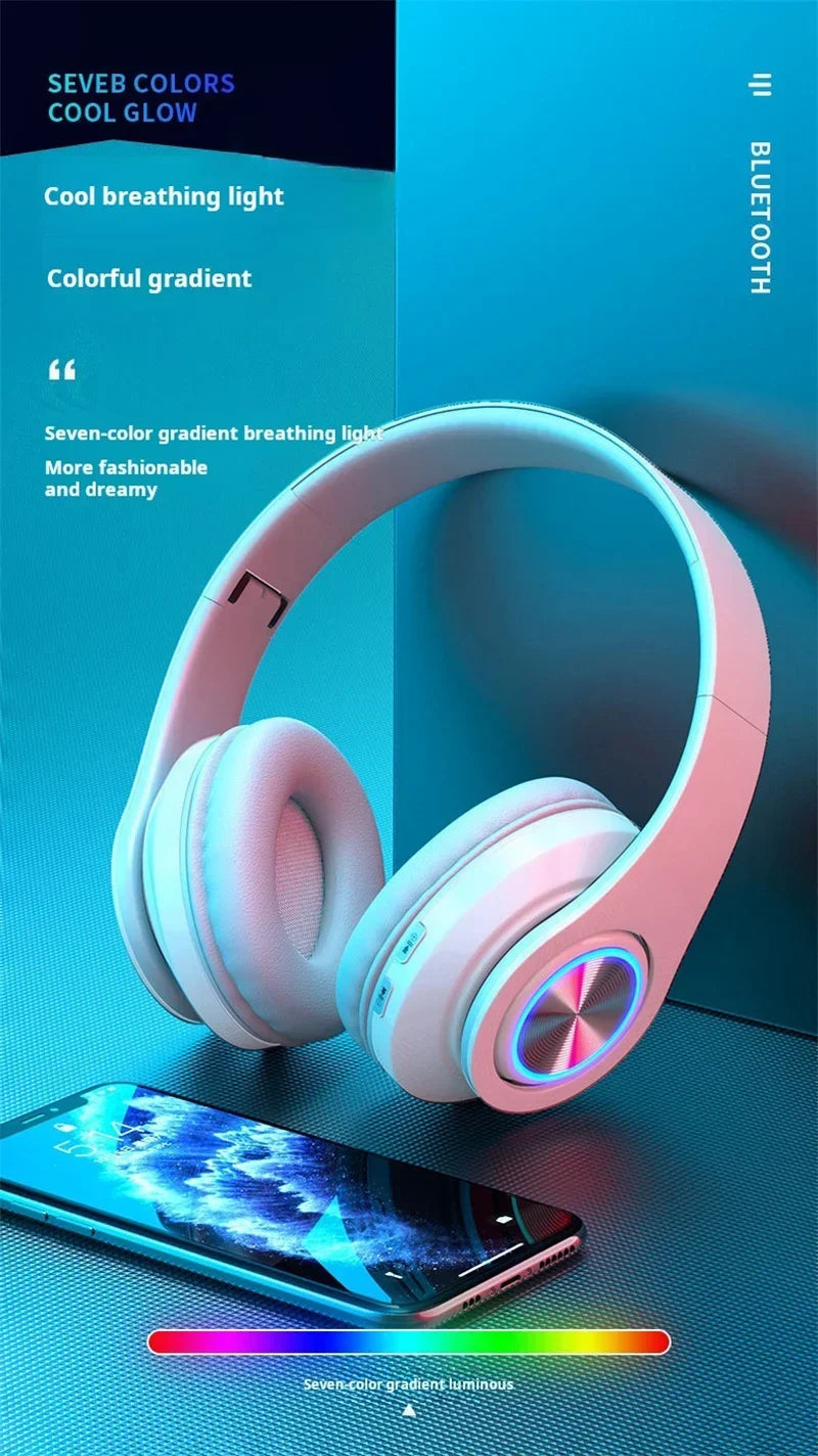 White wireless gaming headset featuring comfortable ear cups and a vibrant, multi-coloured glowing LED ring design.