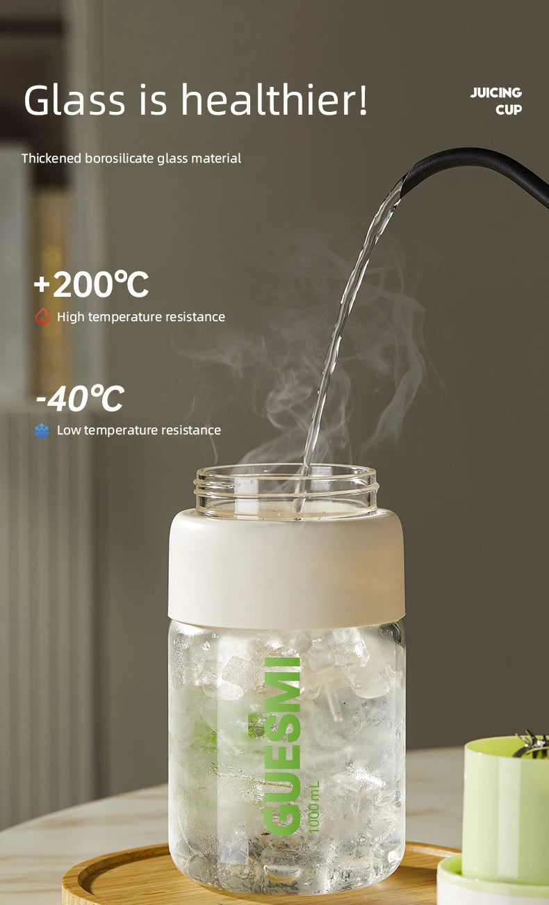 Clear 1000ml borosilicate glass cup with an off-white lid, designed for hot or cold liquids.