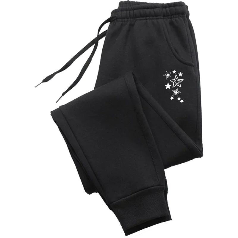 Black fleece joggers with drawstring waist, cuffed ankles, and a white star cluster print on the pocket.