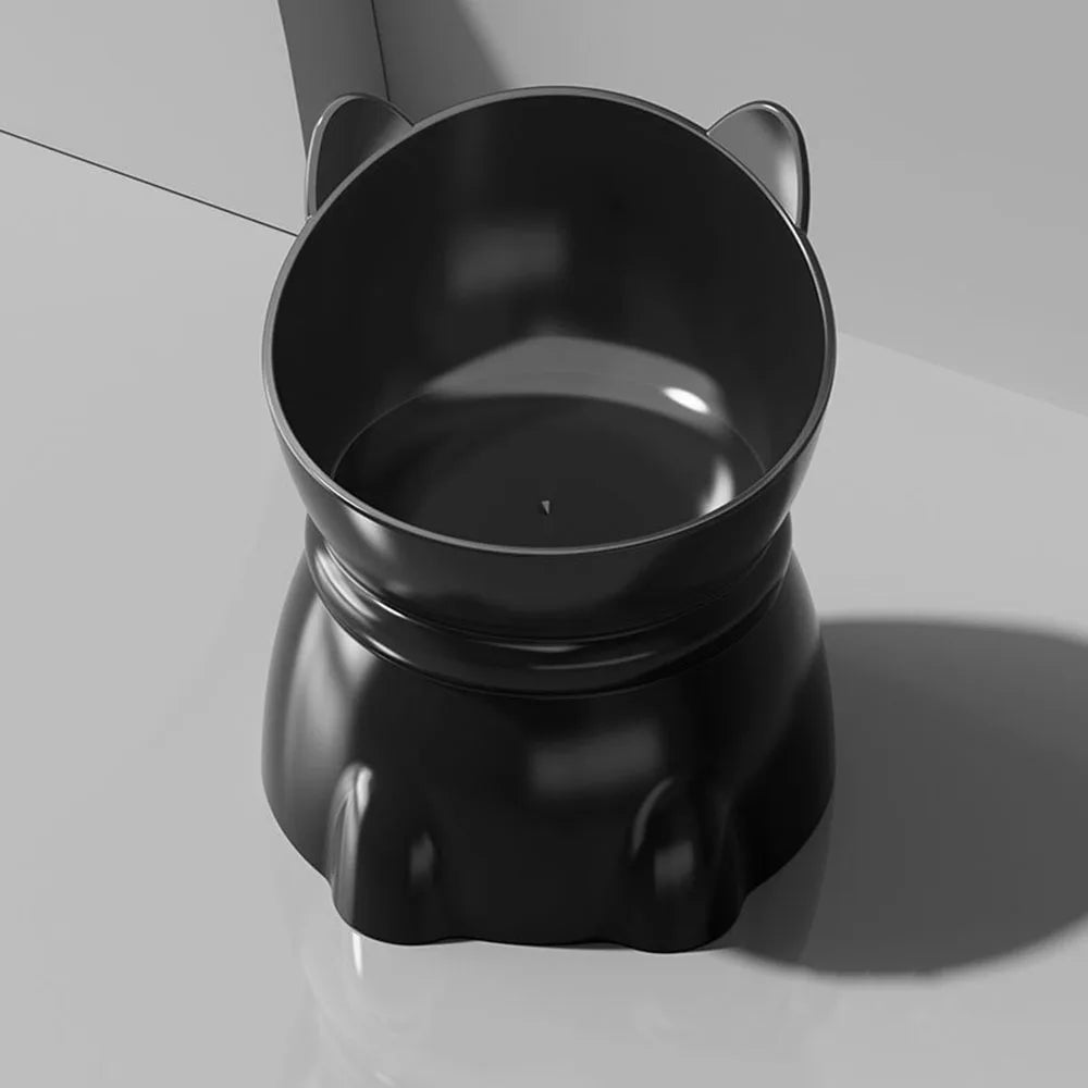 Elevated black cat-shaped feeding bowl with ergonomic tilted design on a light grey background.