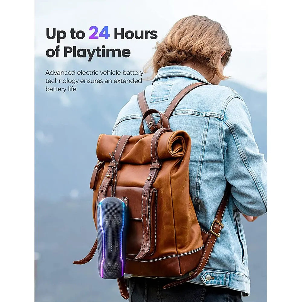 A person with a brown leather backpack carries a black, portable waterproof Bluetooth speaker with glowing LED lights.