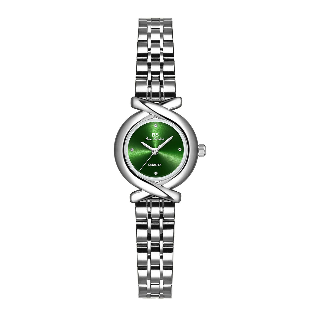 Women's silver-tone stainless steel quartz wristwatch with a round, emerald green dial and elegant crossover lugs.