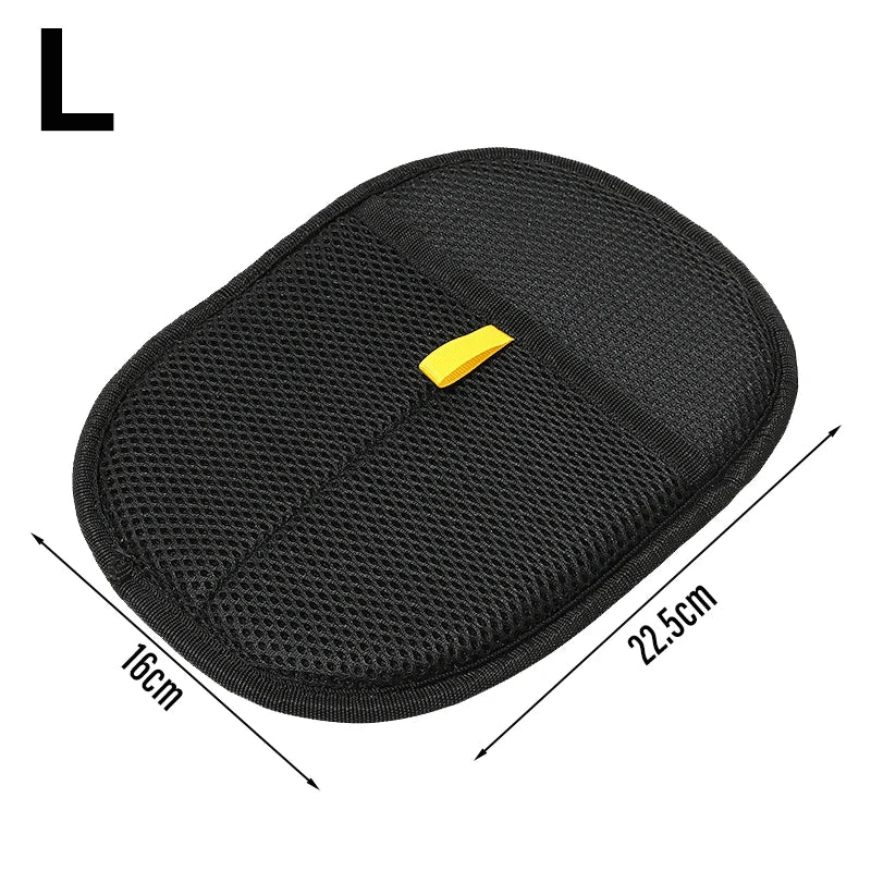 Large oval black mesh cleaning pad with a yellow fabric pull tab, measuring 16cm by 22.5cm.