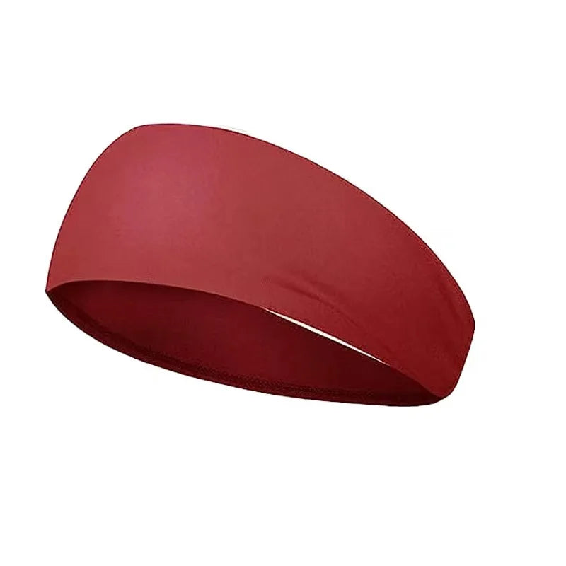 A plain, wide maroon red sports headband on a white background.