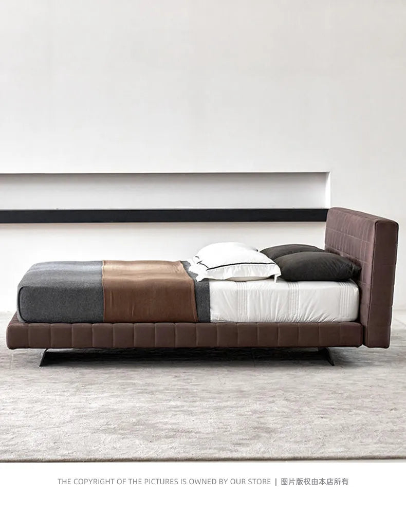 Modern Nordic-style upholstered bed frame in dark brown fabric with a tall, panel-stitched headboard.