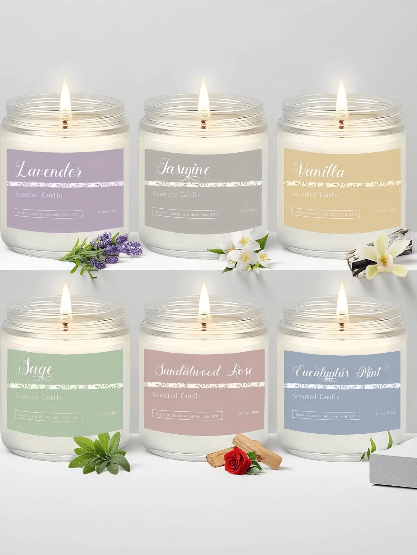 Six lit scented candles in glass jars with pastel labels for Lavender, Jasmine, Vanilla, Sage, Sandalwood Rose, and Mint.