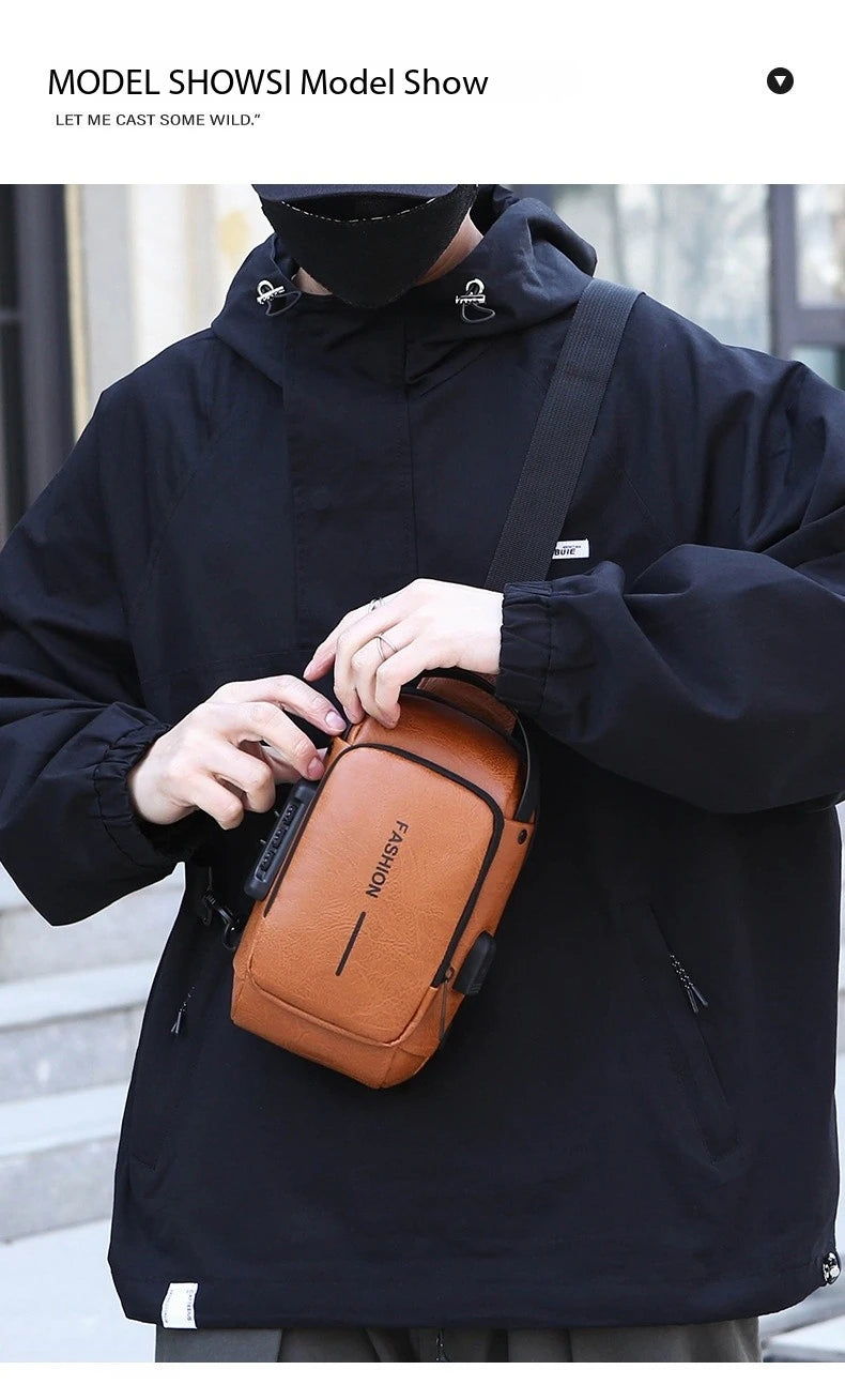 Tan leather-look anti-theft crossbody sling bag with a built-in USB port, worn by a man in a black jacket.