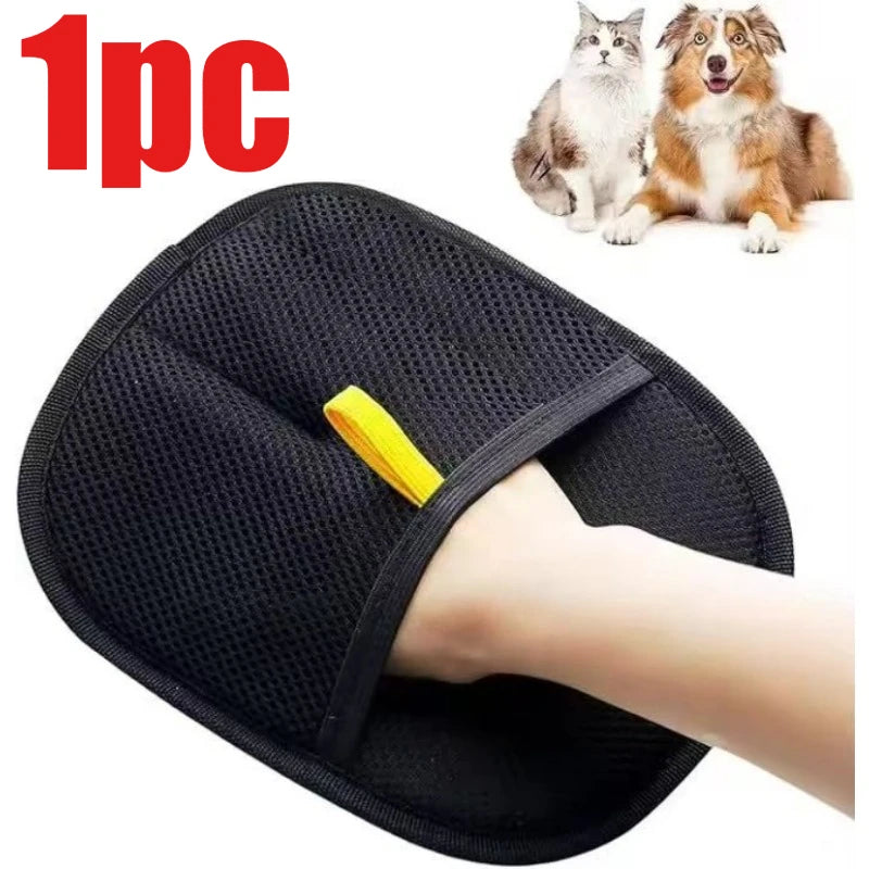 Black mesh pet grooming glove with a yellow wrist strap being worn on a hand, near a dog and cat.