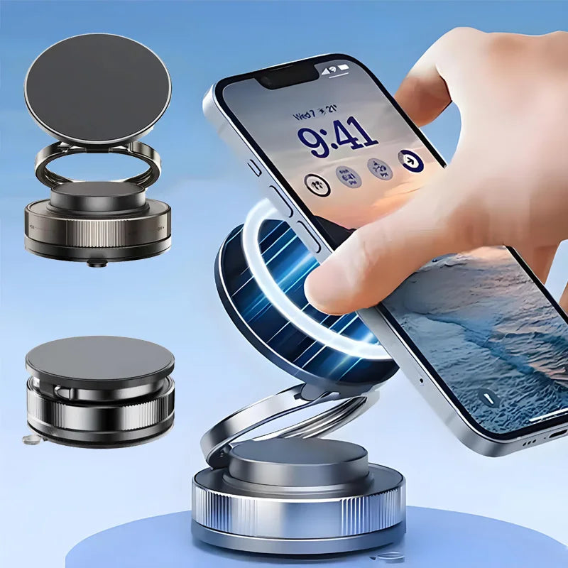 Adjustable dark grey magnetic phone stand with a circular, foldable design holding a smartphone.
