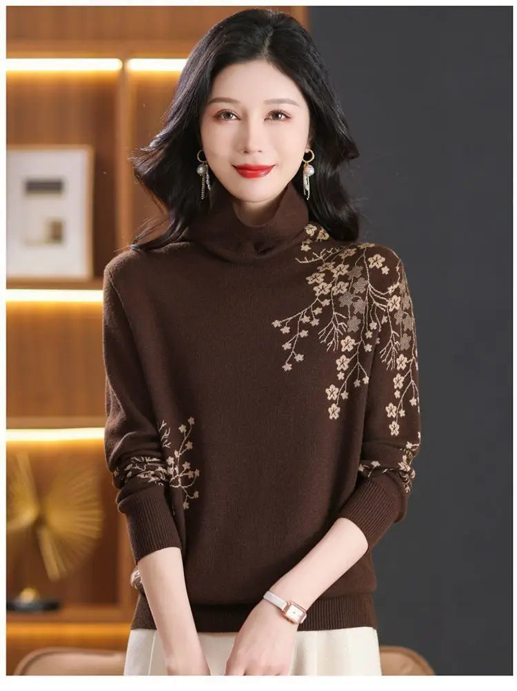 Brown turtleneck sweater featuring delicate beige floral embroidery on the shoulder and sleeve.
