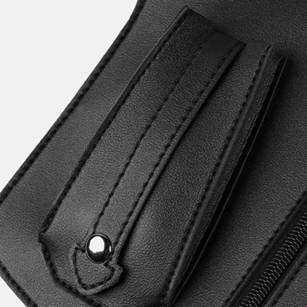 Close-up of a black faux-leather tactical bag featuring durable double-stitched seams and a silver metal stud detail.