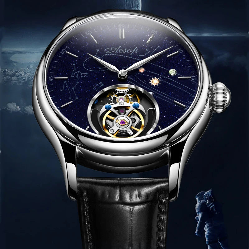AESOP silver mechanical watch with round blue star-map dial, visible tourbillon movement, and black leather strap.