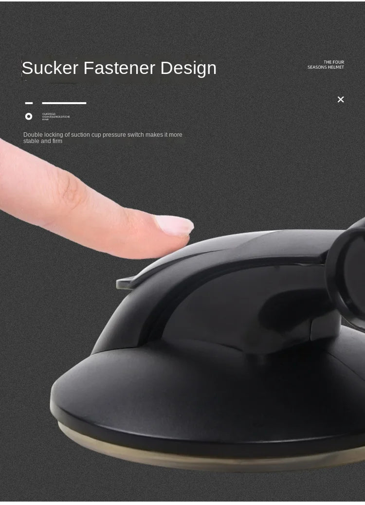 Black plastic suction cup fastener with a pressure-locking switch, shown being pressed by a finger.