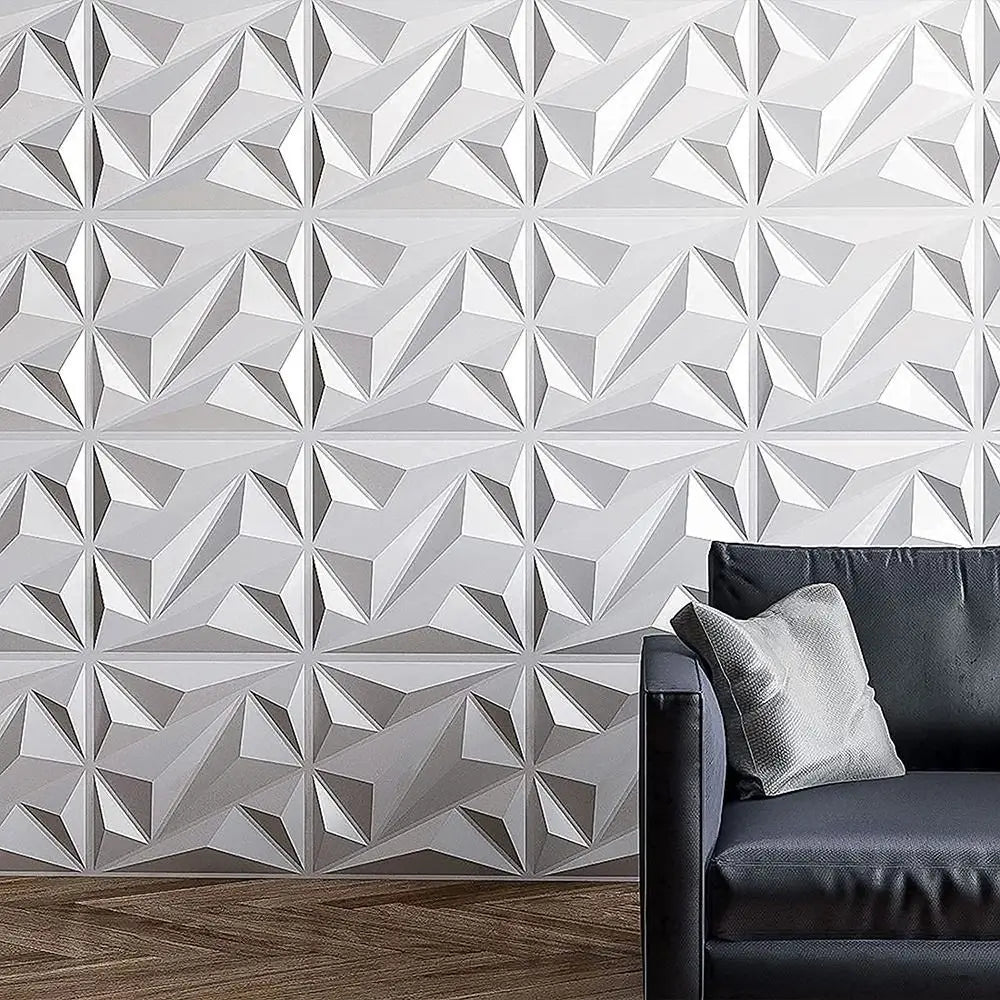 White 3D diamond-pattern wall panels behind a modern sofa, creating a stylish, textured geometric feature wall.