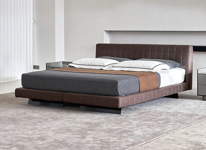 Modern Nordic-style bed frame in chocolate brown fabric with a quilted headboard and minimalist low-profile design.