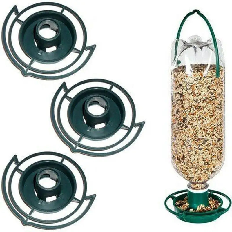 Three dark green circular bird feeder attachments next to a clear plastic bottle bird feeder filled with birdseed.