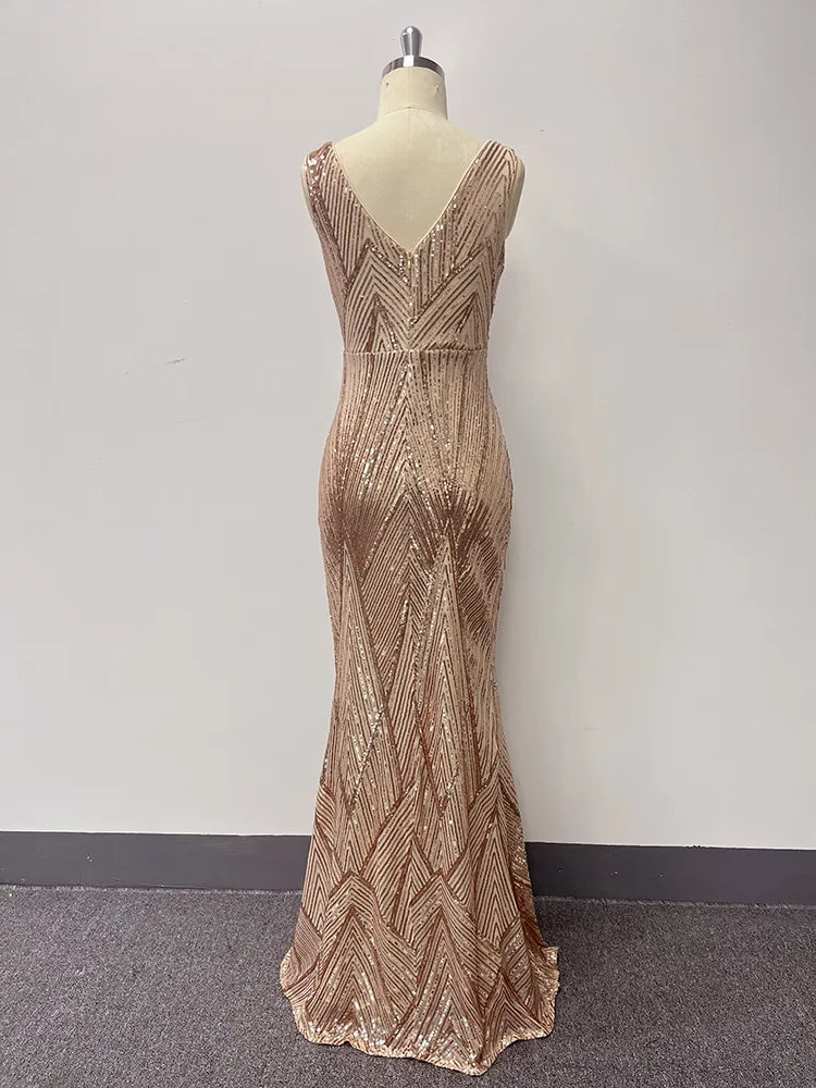 Gold sequin V-neck evening dress on a mannequin, shown from the back, featuring a fitted mermaid silhouette and chevron pattern.