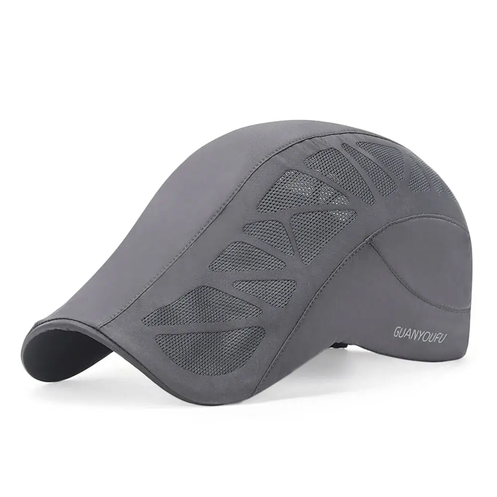 Grey men's flat cap with breathable mesh cut-out panels and a curved brim.