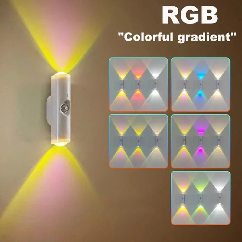 Modern white cylindrical wall lamp with motion sensor, featuring upward and downward RGB colour-changing LED beams.