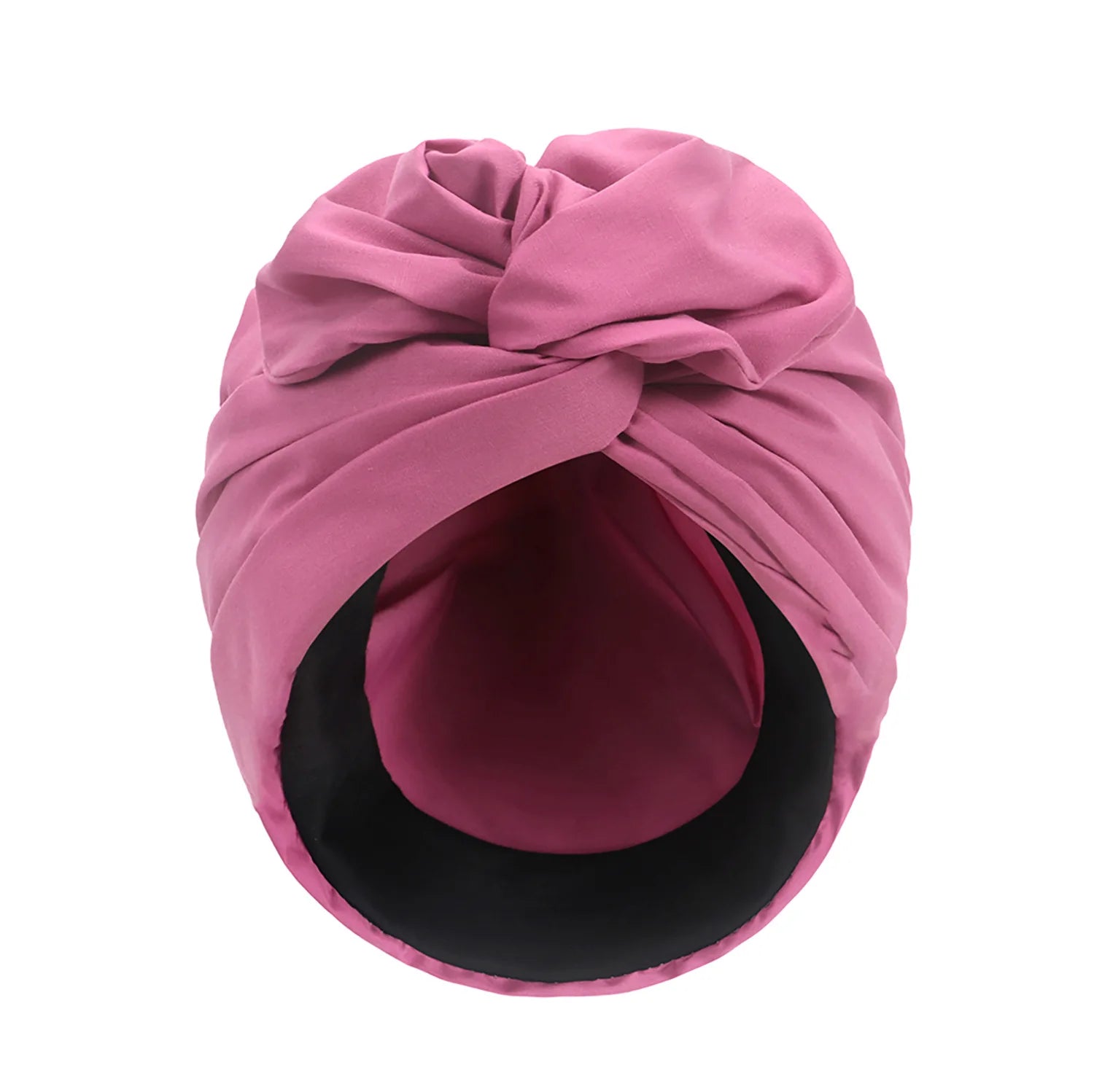 Dusty pink vintage-style turban hat with a decorative front knot and a smooth black inner lining.