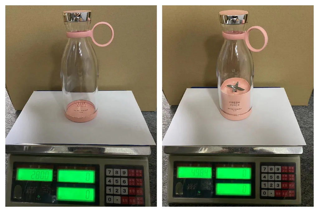 A portable, pink and clear glass smoothie blender bottle with a carry loop, shown being weighed on a digital scale.