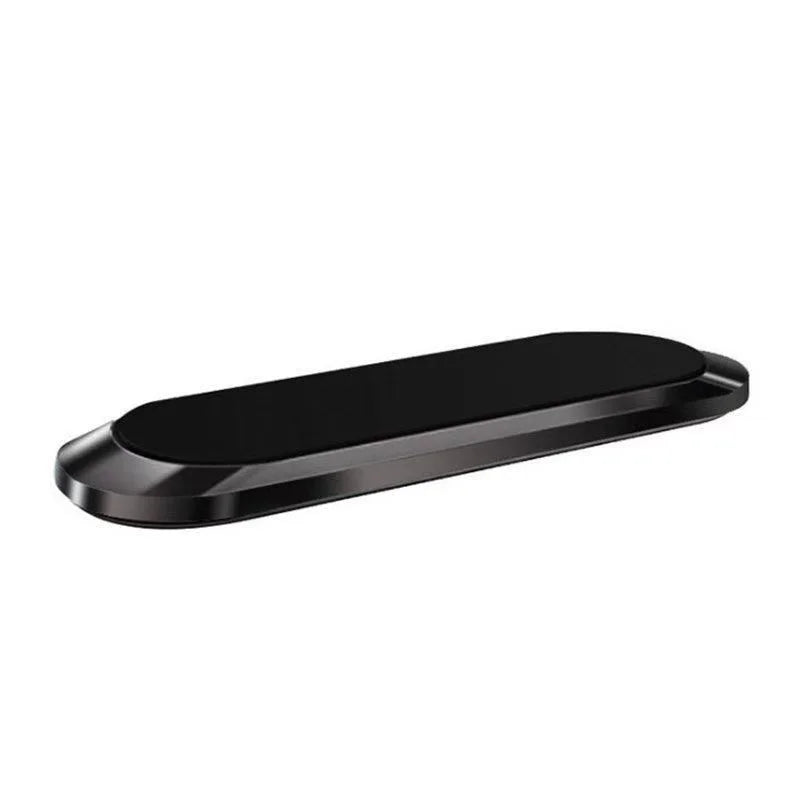 A sleek, black, oval-shaped magnetic phone mount with a smooth, glossy top surface and metallic frame.