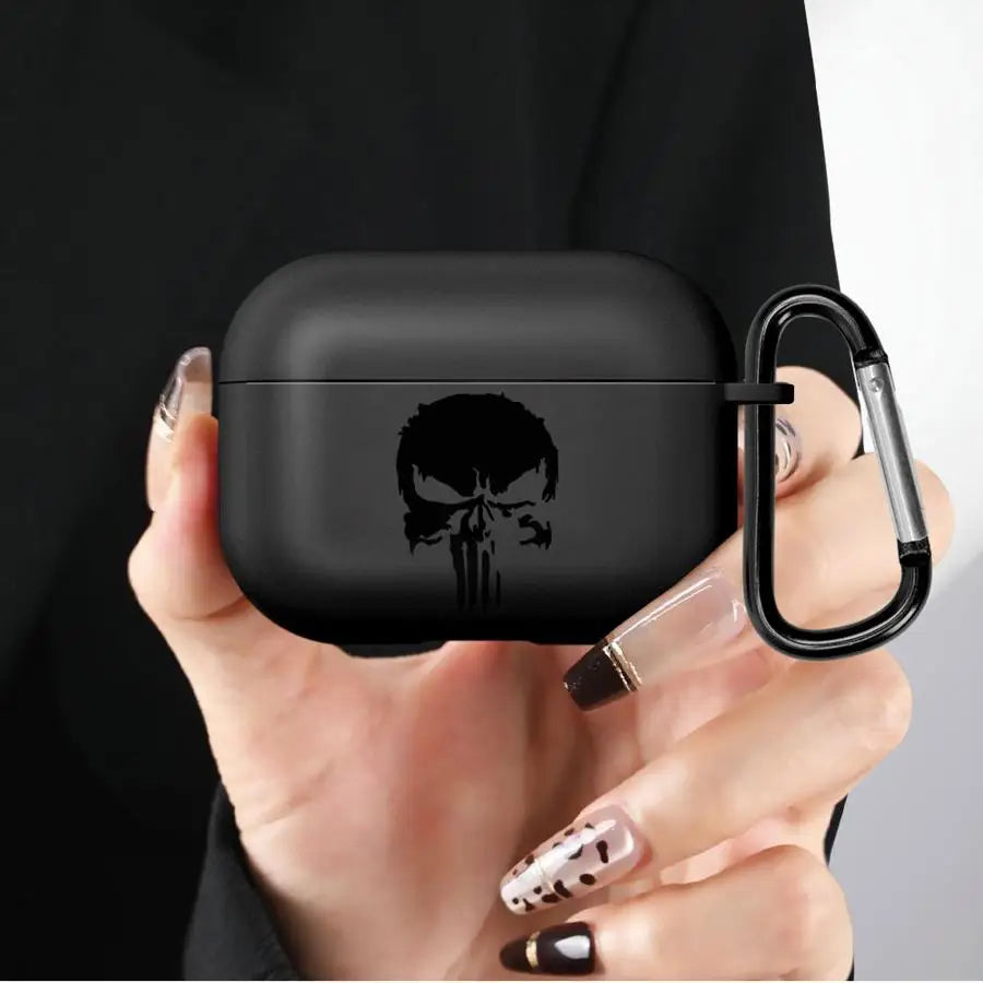 Black silicone AirPods Pro case featuring a Punisher skull print with a matching black carabiner clip.