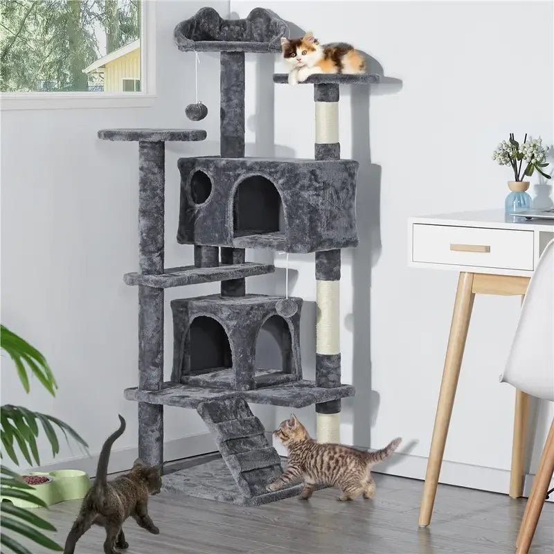 Grey 3-tier cat tree with plush condos, scratching posts, platforms, and hanging toys, with kittens playing nearby.