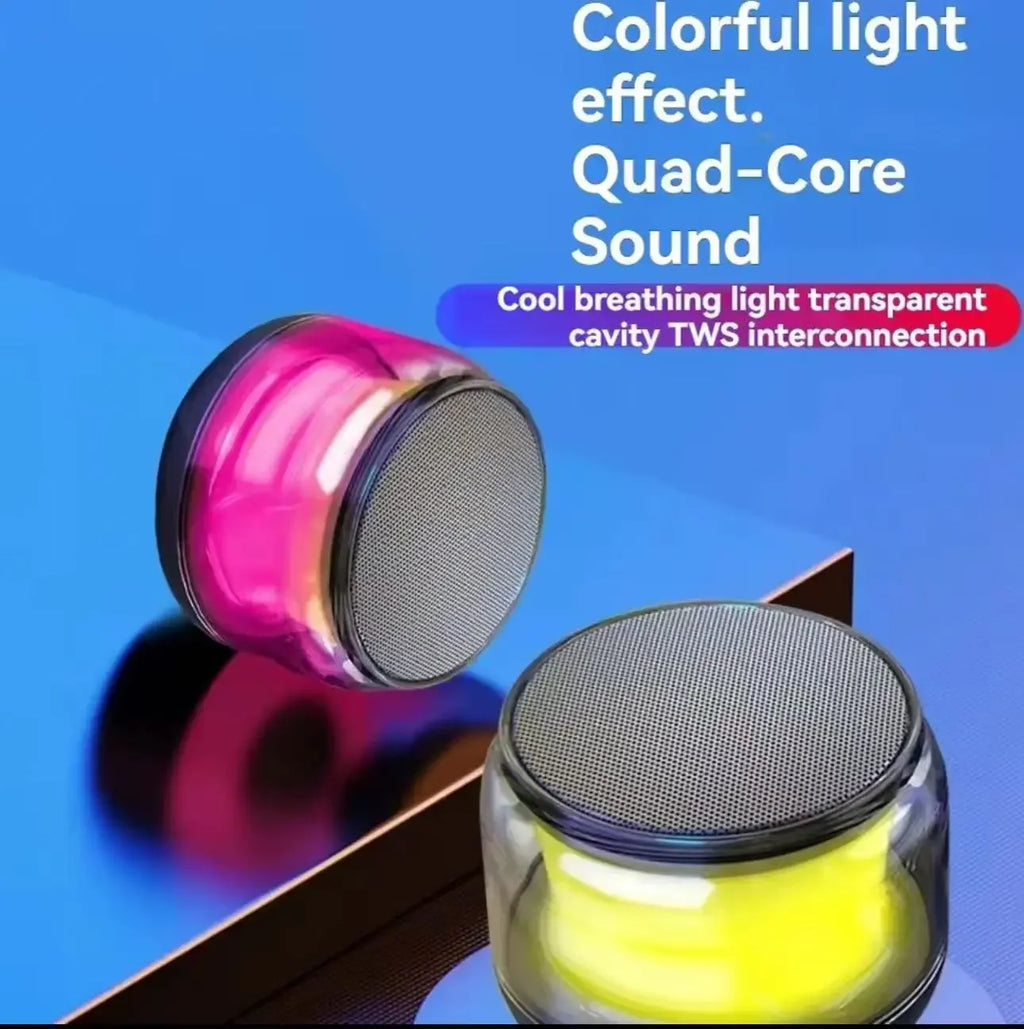 Two portable, transparent wireless speakers with vibrant pink and yellow breathing light effects and metallic grilles.