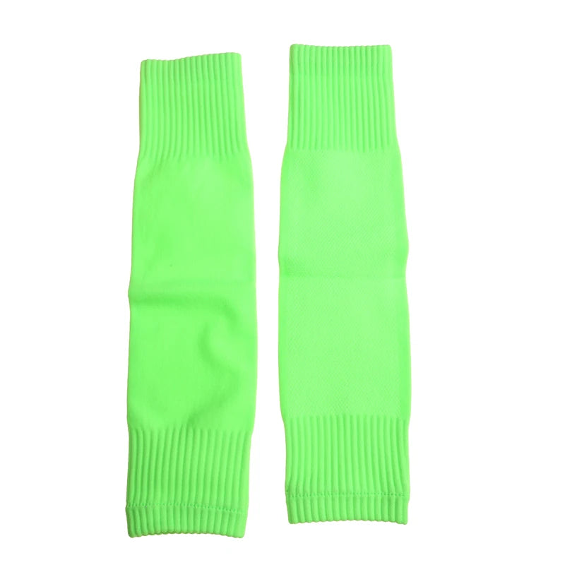 Pair of neon green elasticated sports leg sleeves with ribbed cuffs for a secure, comfortable fit.