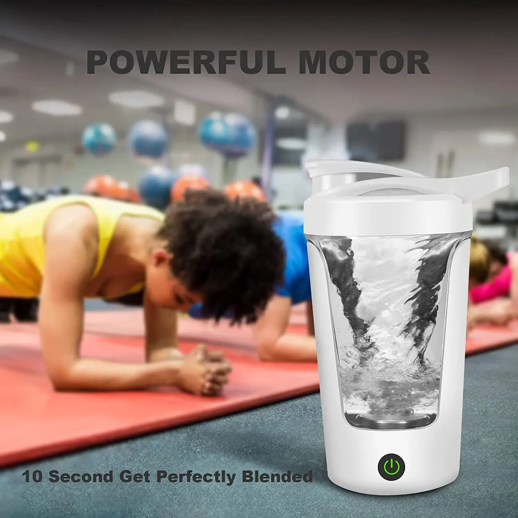 White electric protein shaker bottle with a vortex blending action, featuring a base power button in a gym setting.