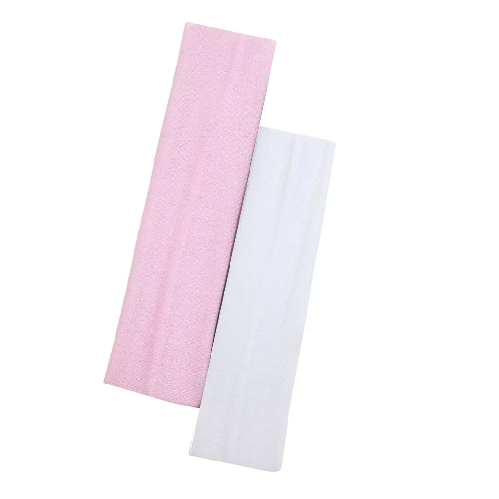 Two flat, fabric elasticated headbands, one in baby pink and one in white, on a plain white background.