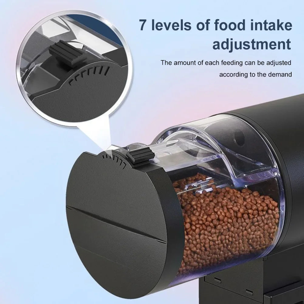 Black automatic pet food dispenser with a clear container and a manual 7-level portion adjustment dial.