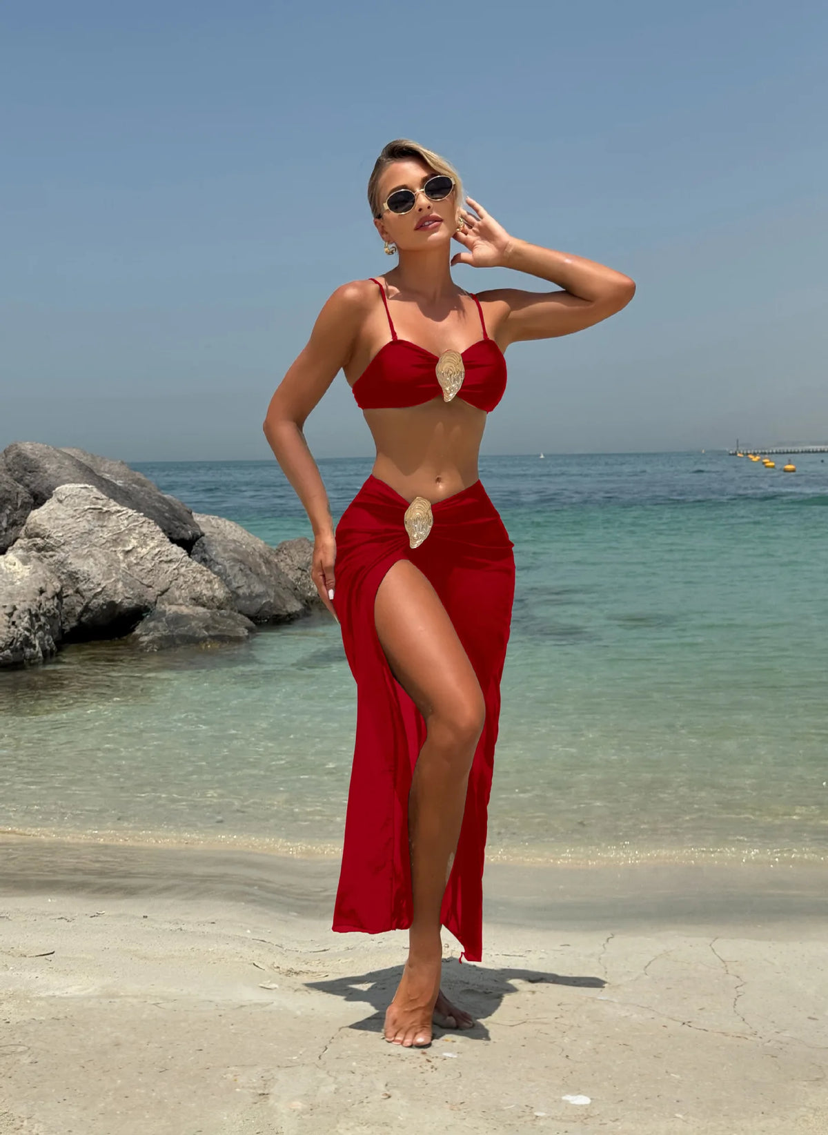 Red 3-piece bikini set with a push-up top and long mesh skirt featuring gold oyster shell buckles.